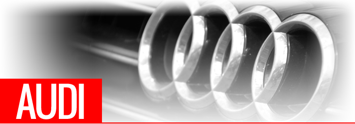 Audi text in front of car grill and badge